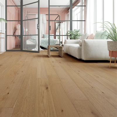 hardwood flooring in living room with white couch, wood table, and plant with glass wall into bedroom.