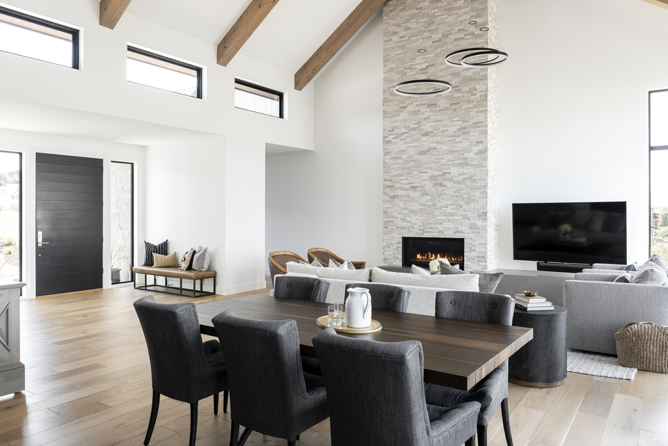 Living room with high ceilings and stone fireplace 